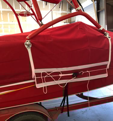 Boat cover with cutouts for ski tower. 