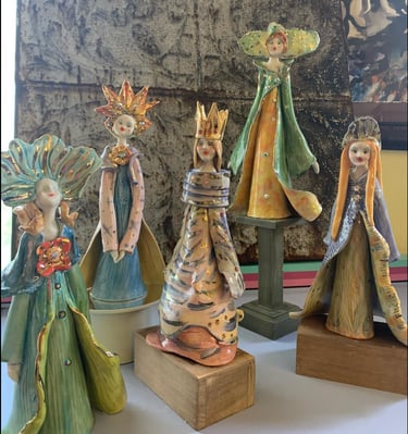 a group of ceramic figurines of three wise wise men and women