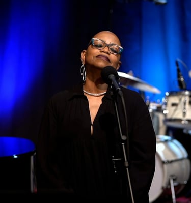 Tiya Adé in a reflective moment during her performance.