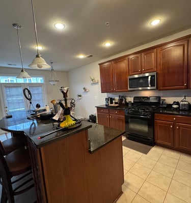 a kitchen with a stove top oven and a microwave
