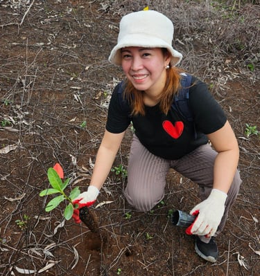 woman planting tree on guam