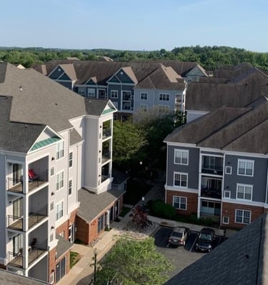Aerial view of an apartment complex exterior painting project by Garnet Painting & Remodeling in Douglas, GA.