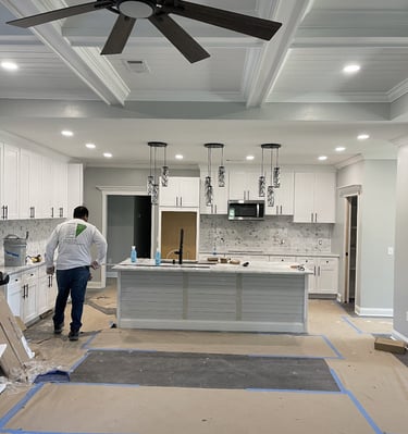 Interior kitchen remodeling project by Garnet Painting — luxury cabinetry, lighting, and ceiling work in Georgia