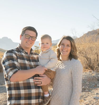 Kody Daffer with his wife Kylie and their young son, a Nampa, Idaho family, smiling together outdoor
