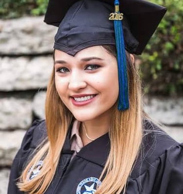 a woman in a graduation cap and gown
