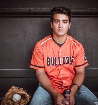 a man in a baseball uniform is posing for a picture