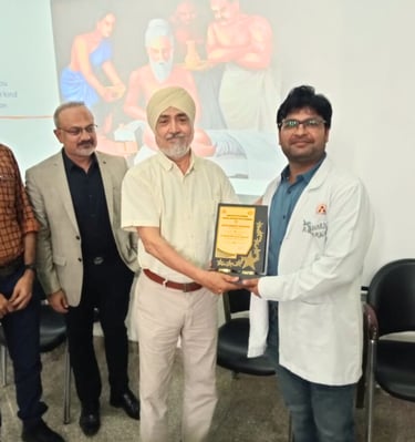 Best plastic surgeon in Udaipur Dr. Bharat Agarwal receiving 1st prize in plastic surgery
