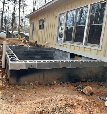 a concrete block foundation being built into a house