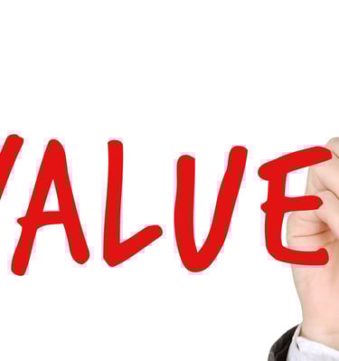 hand writing the word "values" with a marker symbolizing augusta precious metals blog post about their values