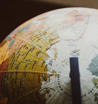 globe showing different countries and nations representing Gold IRA and geopolitical risk