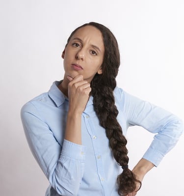 woman thinking thoroughly and wondering if gold ira is a scam