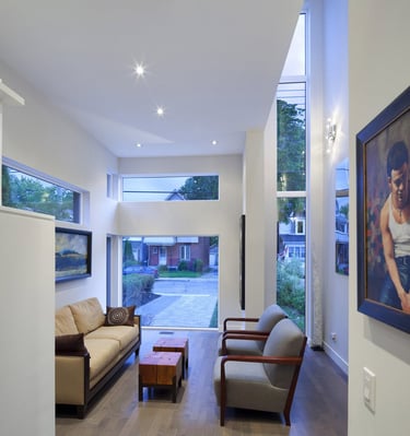 a living room with a couch and a painting