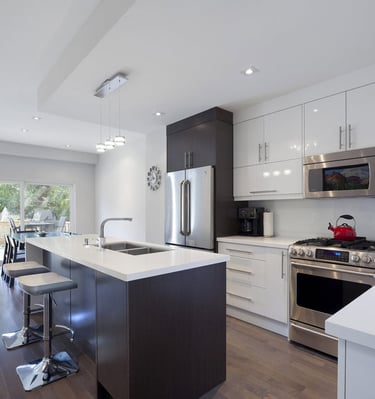 a kitchen with a stove top oven and a sink