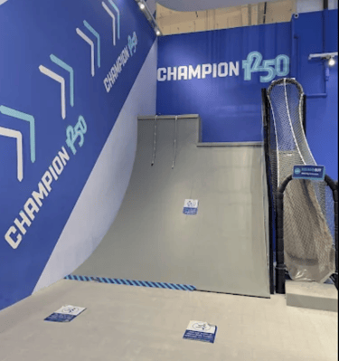 a playground is riding down a ramp at the skate park