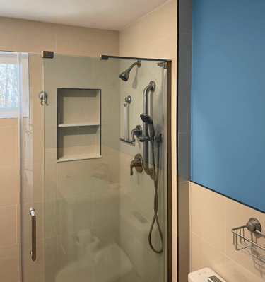 a bathroom with a shower and a toilet