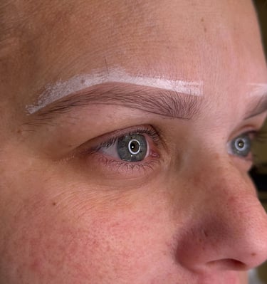 Woman after getting her eyebrows mapped by microblading master, ready for the procedure