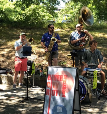 river city riot brass band playing at portland waterfront blues fest, mardi gras, new orleans music