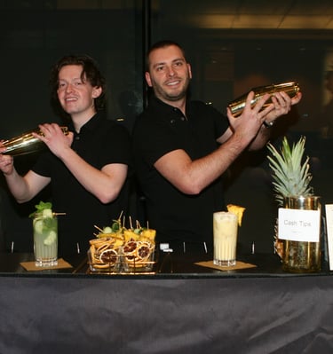 bartenders shaking cocktails for a corporate party