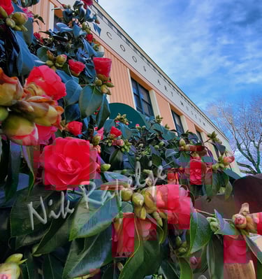 flowers in front of the Coos Art Museum