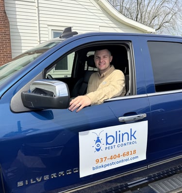 Pest control technician in service truck