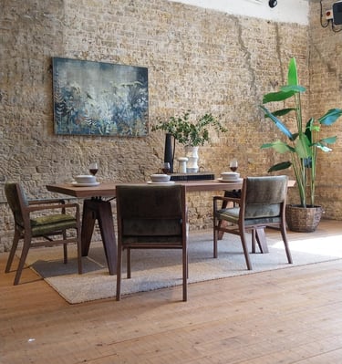 a dining room with a table and chairs