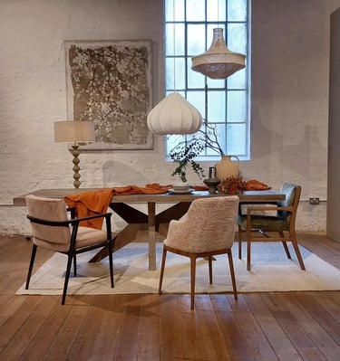 a dining room with a table and chairs