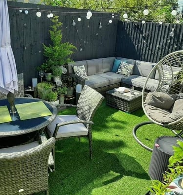 a patio with a table and chairs and a table
