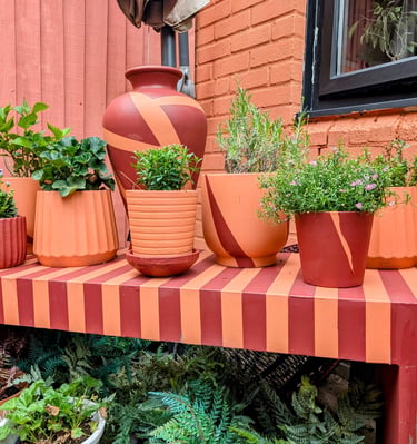 stripe concerete bench with matching pots and plants