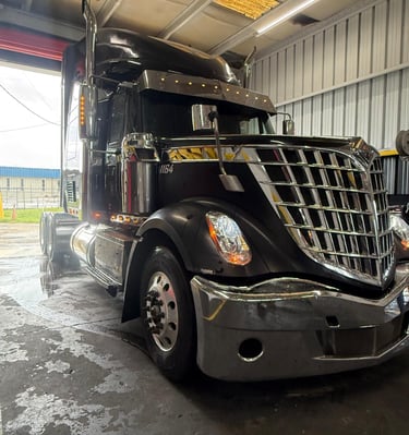 a semi truck parked in a garage
