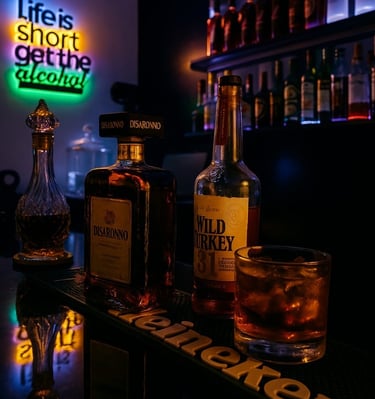 Disaronno and Wild Turkey whiskey bottles at a neon-lit cocktail bar with a glass of ice.