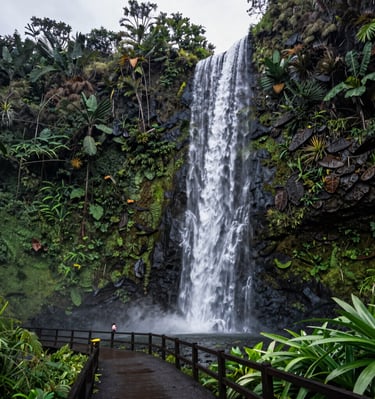 An elegant open-air living space with ocean views and tropical greenery.