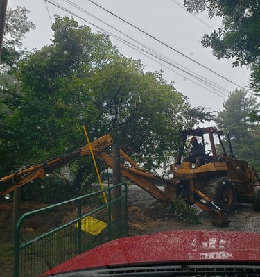 a tractor with a loader on it's back end