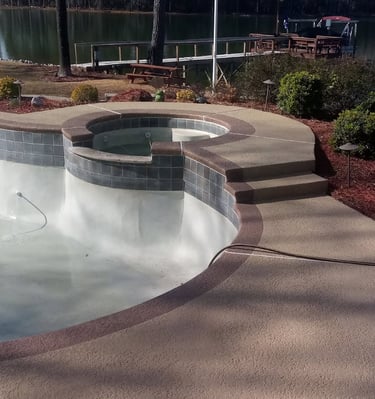 a pool with a large pool and a dock