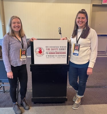Two people standing in front of a podium