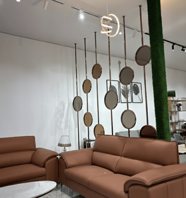 Contemporary brown leather sofa set at furniture showroom in Bengaluru