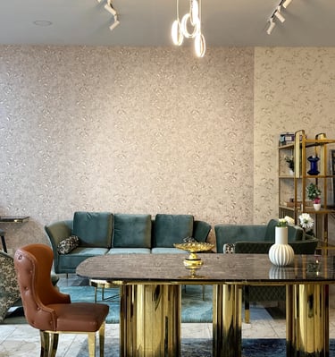 Luxury dining table and sofa setup at furniture showroom in Bengaluru