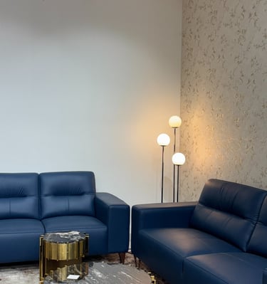 Premium blue leather sofa set at furniture store in Bengaluru