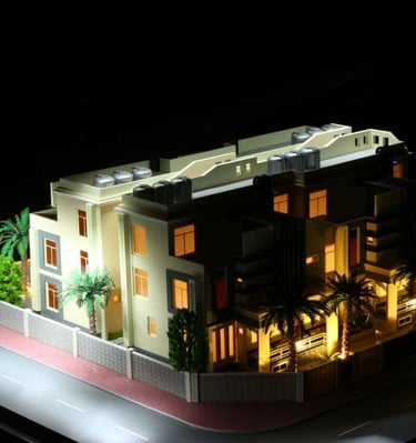 Detailed architectural model of a modern multi-story villa with interior lighting and palm trees