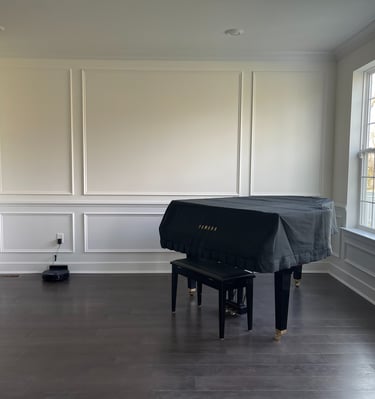 Picture-frame wainscoting installed in a Monmouth County piano room