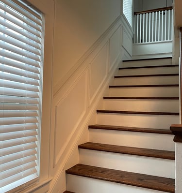 White staircase wall panels and wainscoting in a Monmouth County home