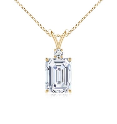 Emerald cut diamond pendant necklace in 14k yellow gold with round accent stone.