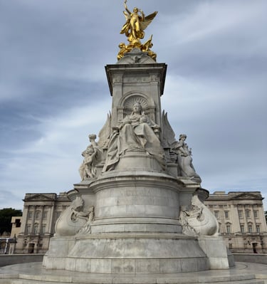 The Victoria Memorial monument in London with Buckingham Palace in the background.