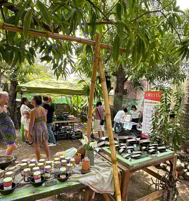 farmers market stand selling jams and pottery