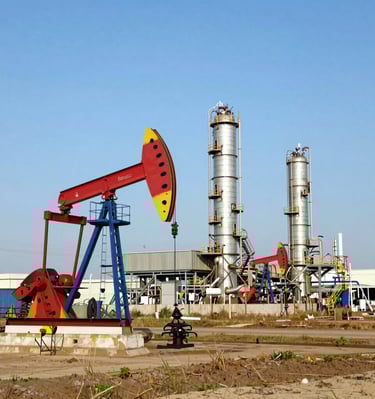 A meeting between royalty owners and consultants reviewing real estate documents.