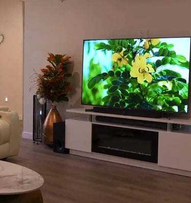 Cozy living room in adult family home with comfortable sofas, chairs, and a warm, home-like atmosphere for residents.
