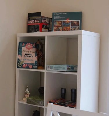 Adult family home activity area with games and entertainment, providing fun and engagement for residents.