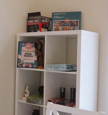 Adult family home activity area with games and entertainment, providing fun and engagement for residents.