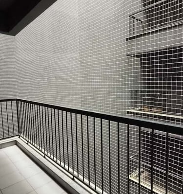 Evening view of a residential building in Chennai with all balconies protected by safety nets
