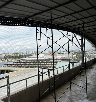 Photo capturing the durable material and tight weave of the pigeon net used by Arjilli Safety Nets.