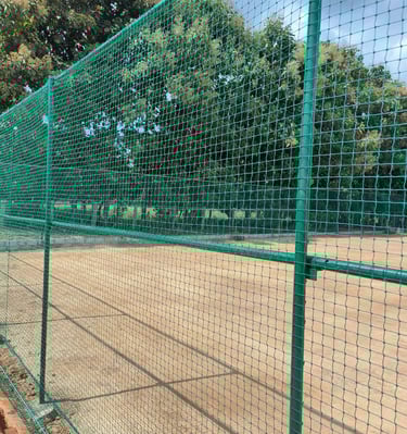 Close-up of a sturdy sports net tightly secured on a cricket practice area in Mumbai